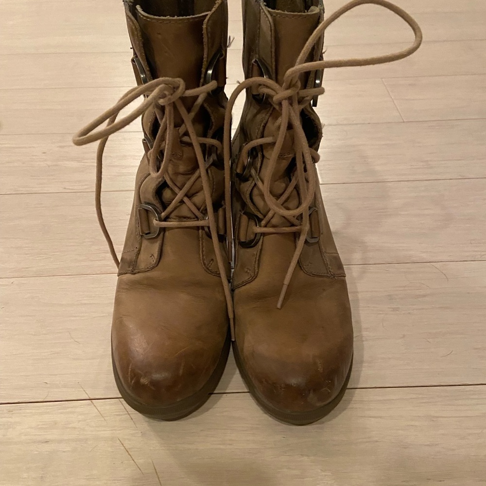 Sorel lace up wedge booties.